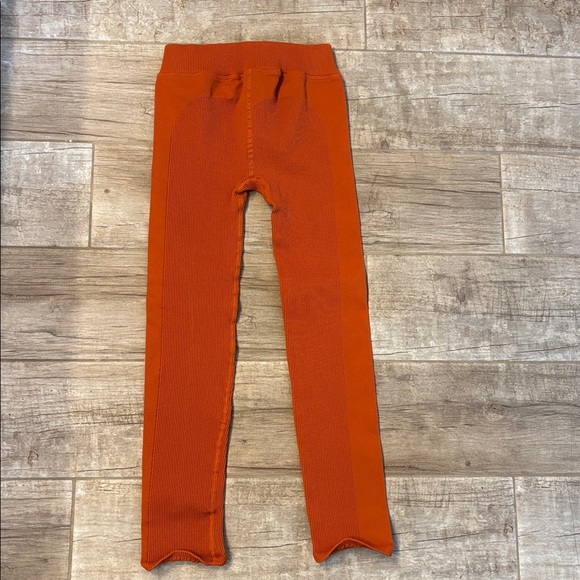 Free People Movement Happiness Runs ribbed leggings in a bright orange color. - Picture 3 of 3